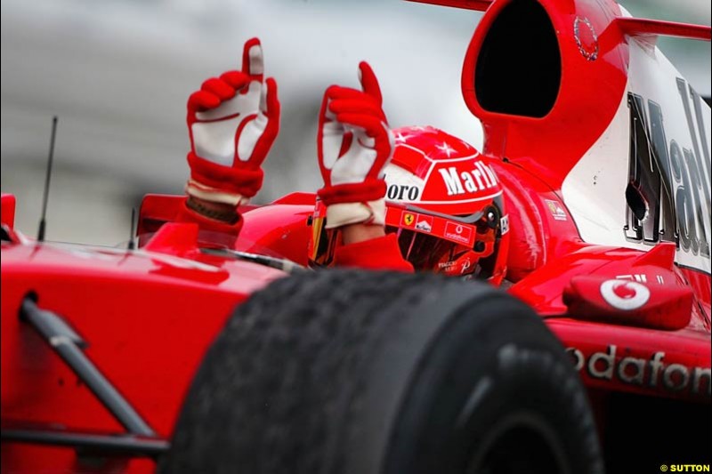 Michael Schumacher, Ferrari, celebrates victory. The Malaysian Grand Prix. Sepang, Kuala Lumpur, Malaysia. March 21st 2004.