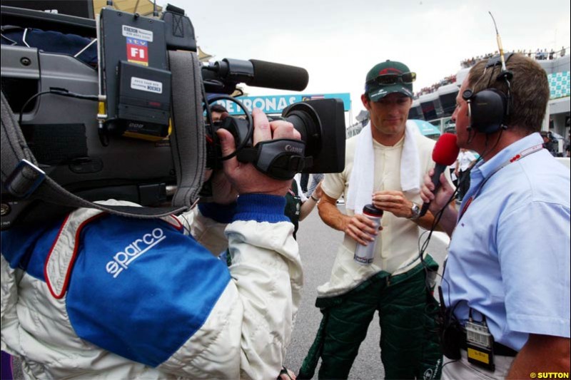 ITV interview Mark Webber, Jaguar. The Malaysian Grand Prix. Sepang, Kuala Lumpur, Malaysia. March 21st 2004.