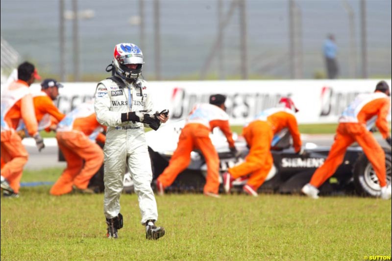 Kimi Raikkonen, McLaren, after retiring from the race. The Malaysian Grand Prix. Sepang, Kuala Lumpur, Malaysia. March 21st 2004.