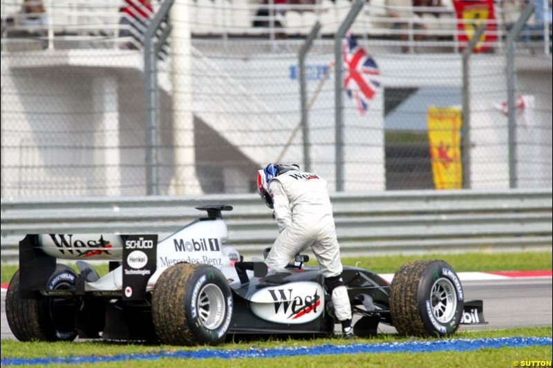 Kimi Raikkonen, McLaren, after retiring from the race. The Malaysian Grand Prix. Sepang, Kuala Lumpur, Malaysia. March 21st 2004.