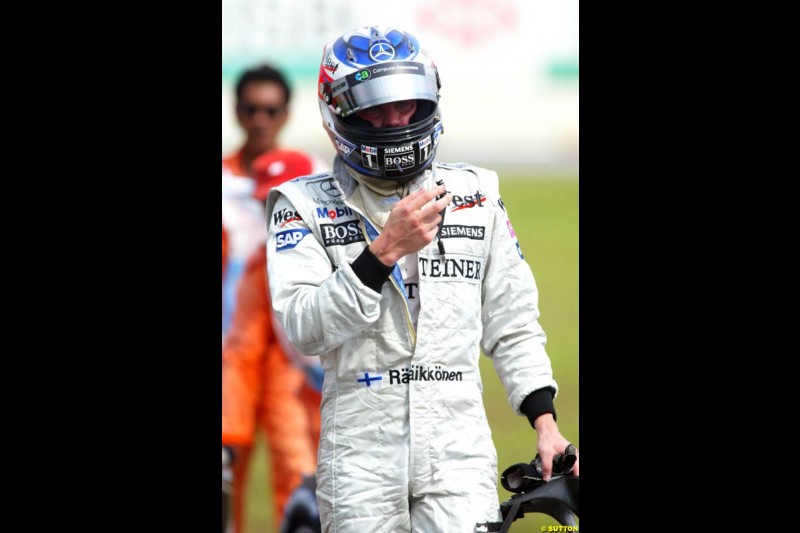 Kimi Raikkonen, McLaren, after retiring from the race. The Malaysian Grand Prix. Sepang, Kuala Lumpur, Malaysia. March 21st 2004.