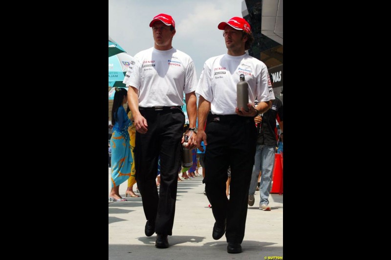 Olivier Panis and Cristiano da Matta, Toyota, at the drivers parade. The Malaysian Grand Prix. Sepang, Kuala Lumpur, Malaysia. March 21st 2004. 
