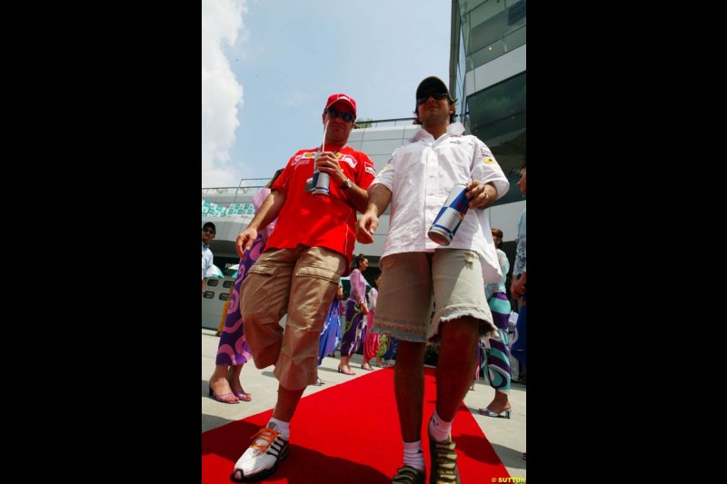 Rubens Barrichello and Felipe Massa at the drivers parade. The Malaysian Grand Prix. Sepang, Kuala Lumpur, Malaysia. March 21st 2004.