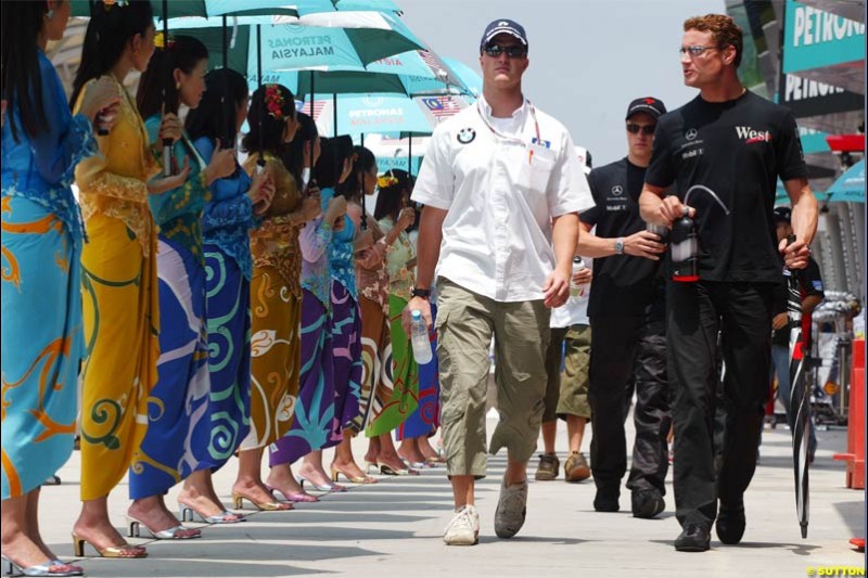 Ralf Schumacher and David Coulthard at the drivers parade. The Malaysian Grand Prix. Sepang, Kuala Lumpur, Malaysia. March 21st 2004. 
