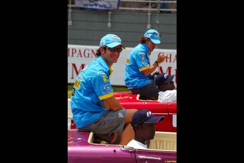 Jarno Trulli and Fernando Alonso, Renault, at the drivers parade. The Malaysian Grand Prix. Sepang, Kuala Lumpur, Malaysia. March 21st 2004. 
