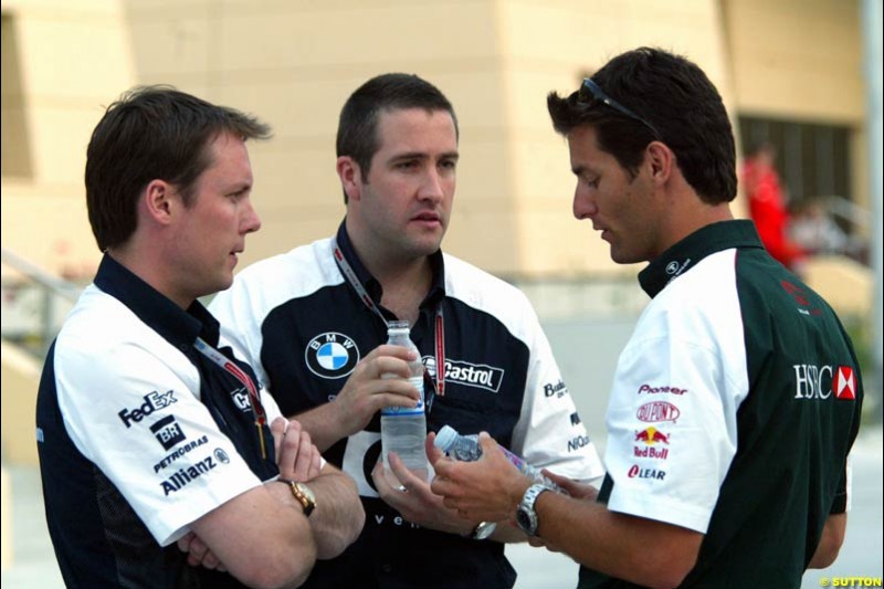 Mark Webber with Williams's Sam Michael. Has the Jaguar driver and the Williams team reached a deal for next season on this occasion? Bahrain Grand Prix, Bahrain International Circuit. April 1st, 2004.