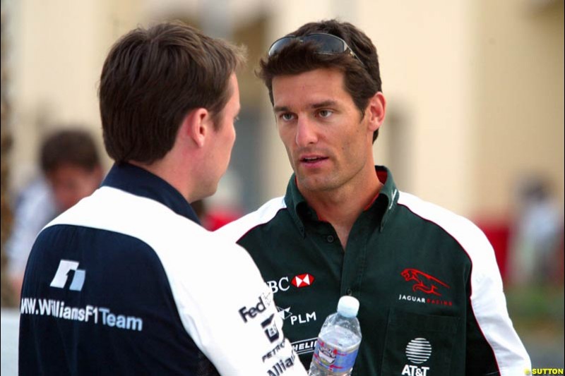 Mark Webber with Williams's Sam Michael. Has the Jaguar driver and the Williams team reached a deal for next season on this occasion? Bahrain Grand Prix, Bahrain International Circuit. April 1st, 2004.
