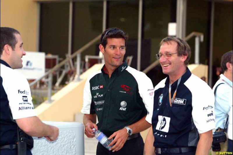 Mark Webber with Williams's Dickie Stanford. Has the Jaguar driver and the Williams team reached a deal for next season on this occasion? Bahrain Grand Prix, Bahrain International Circuit. April 1st, 2004.
