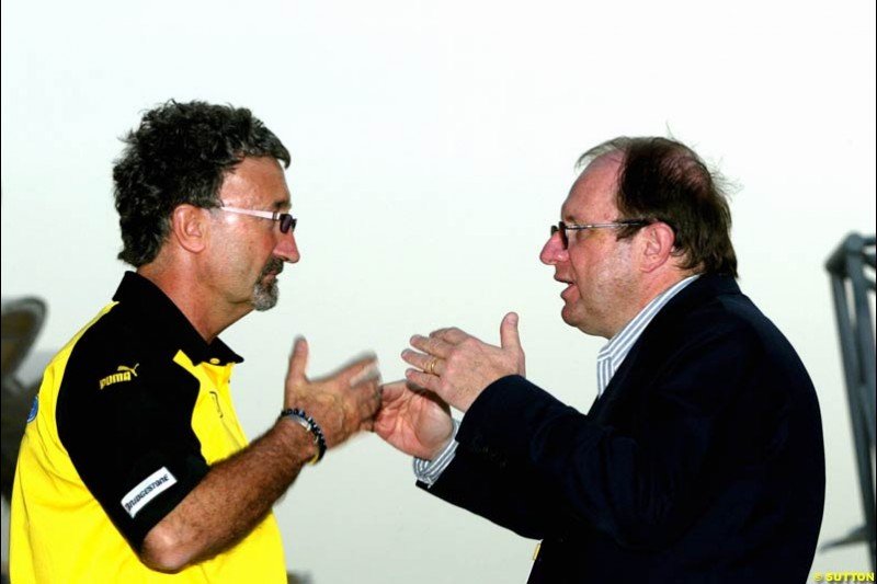 Eddie Jordan with FIA's Marco Piccinini. Bahrain Grand Prix, Bahrain International Circuit. April 1st, 2004.