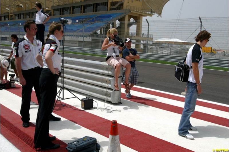 Jenson Button BAR takes part in a photoshoot in the pitlane.  Bahrain Grand Prix, Bahrain International Circuit. April 1st, 2004.