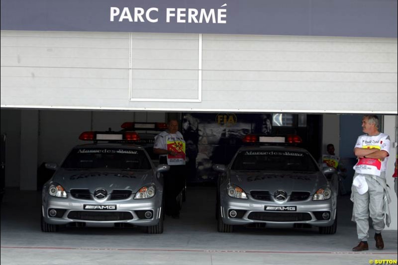 Safety cars parked in the parc ferme garage. Bahrain Grand Prix, Bahrain International Circuit. April 1st, 2004.