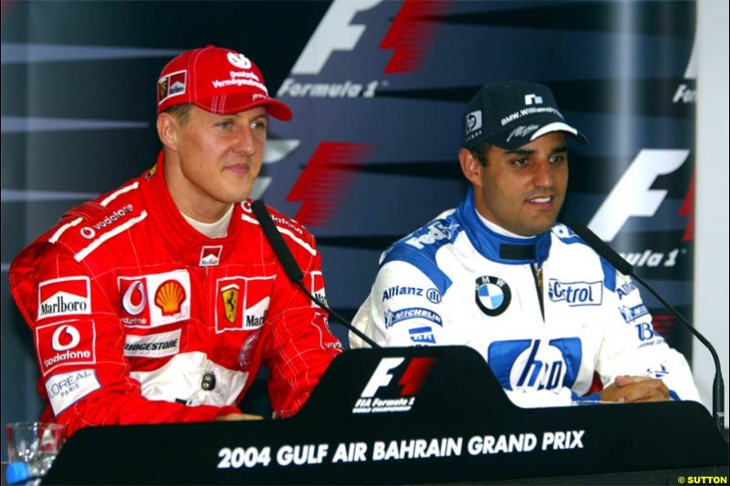 Michael Schumacher and Juan Pablo Montoya. Saturday qualifying for the Bahrain Grand Prix. Bahrain International Circuit, April 3rd 2004.