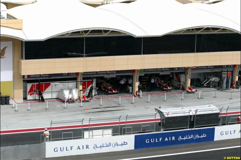 A look at the pits from the grandstand. Saturday qualifying for the Bahrain Grand Prix. Bahrain International Circuit, April 3rd 2004.