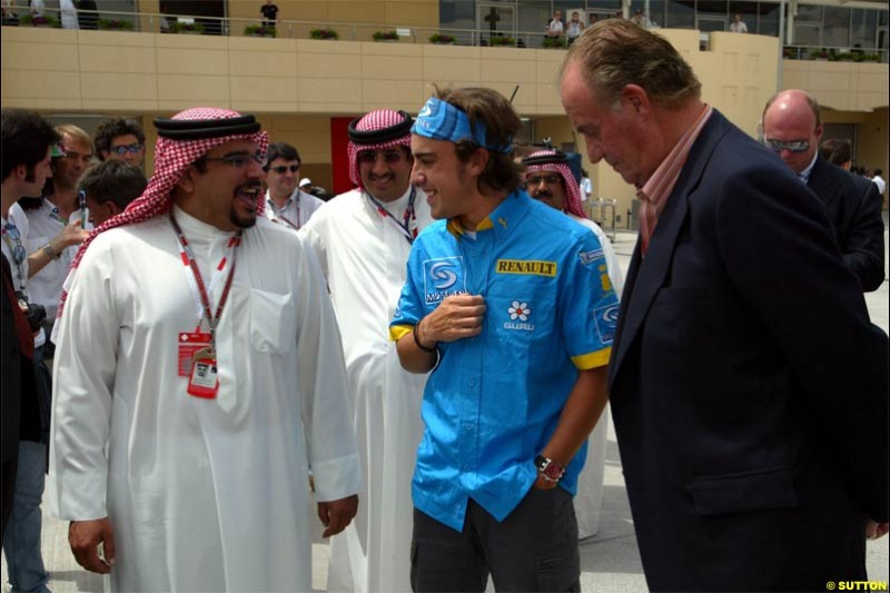 His Highness the Crown Prince Shaikh Salman bin Hamad Al Khalifa with Fernando Alonso Renault and Juan Carlos King of Spain. Saturday qualifying for the Bahrain Grand Prix. Bahrain International Circuit, April 3rd 2004.