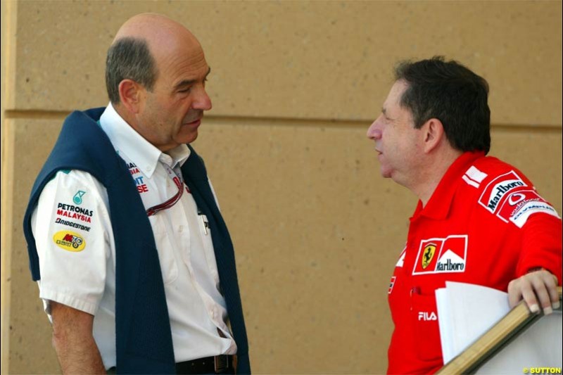 Peter Sauber and Jean Todt. Saturday practice for the Bahrain Grand Prix. Bahrain International Circuit, April 3rd 2004.