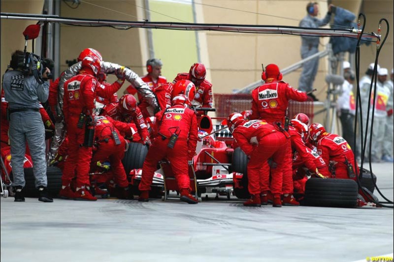 Ferrari pitstop. The Bahrain Grand Prix. Bahrain International Circuit, April 4th 2004.