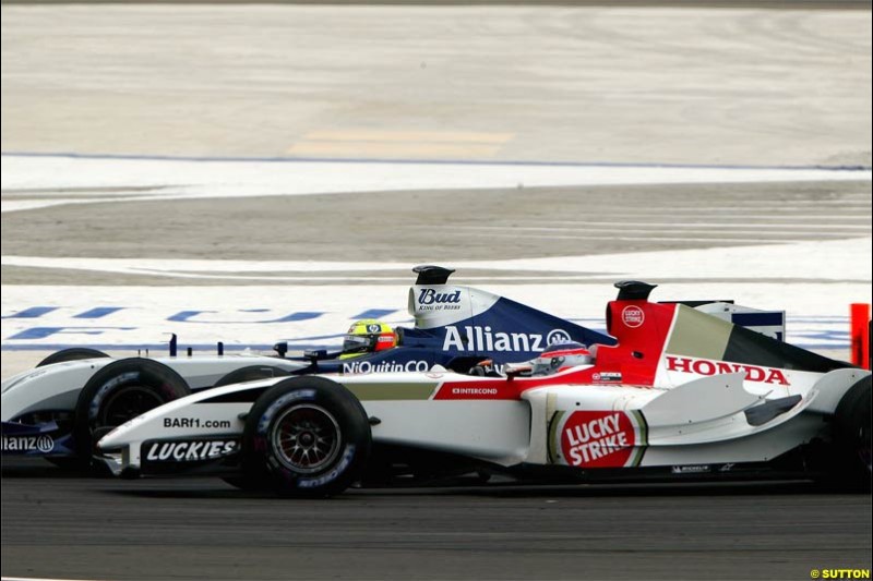 Ralf Schumacher attempts to pass Takuma Sato and ends up being hit. The Bahrain Grand Prix. Bahrain International Circuit, April 4th 2004.