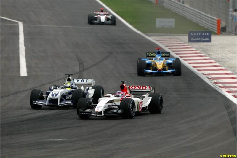 Ralf Schumacher attempts to pass Takuma Sato and ends up being hit. The Bahrain Grand Prix. Bahrain International Circuit, April 4th 2004.