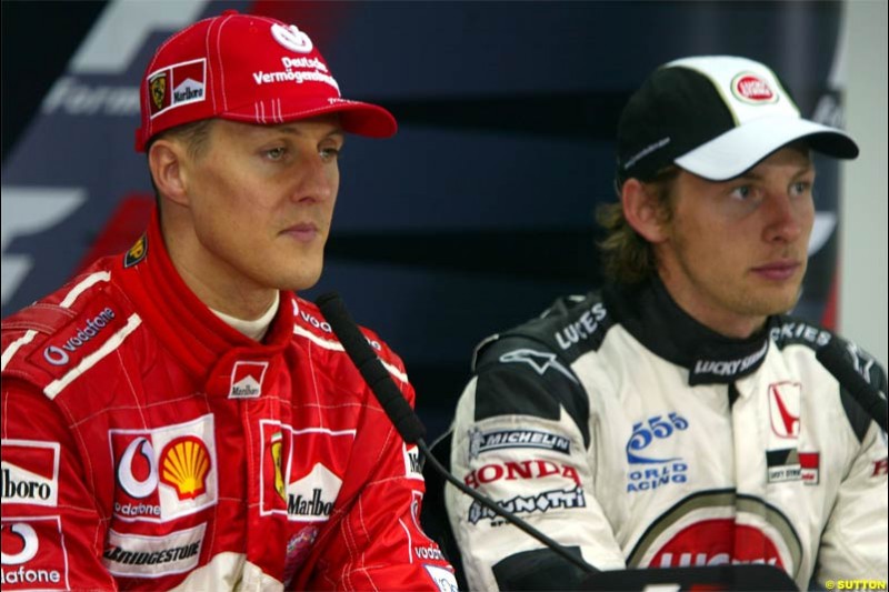 Michael Schumacher, Ferrari, with Jenson Button, BAR. The Bahrain Grand Prix. Bahrain International Circuit, April 4th 2004.