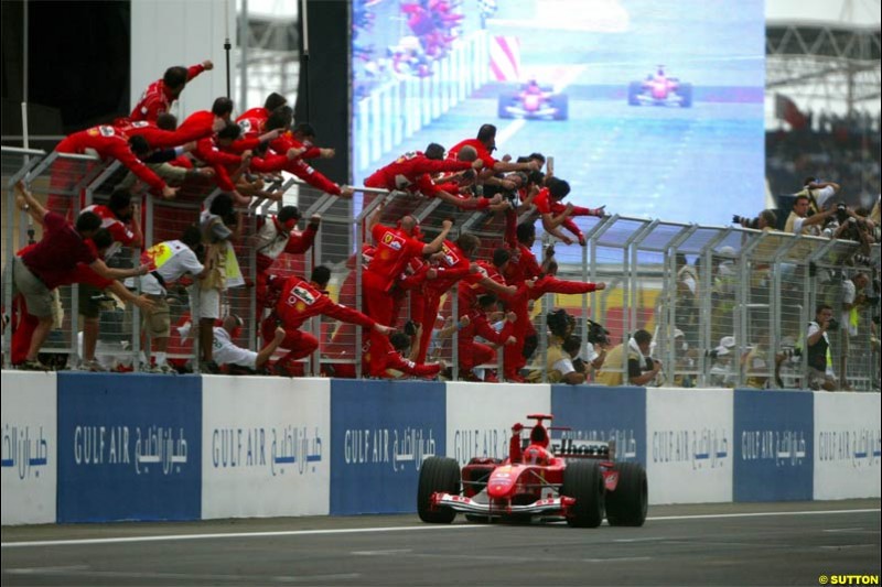 Ferrari celebrate another victory. The Bahrain Grand Prix. Bahrain International Circuit, April 4th 2004.