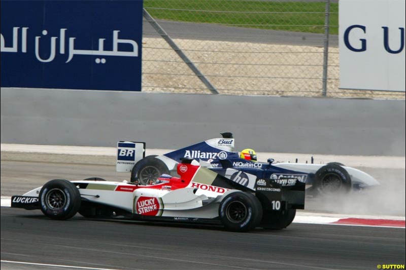 Ralf Schumacher, Williams, comes together with Takuma Sato, BAR. The Bahrain Grand Prix. Bahrain International Circuit, April 4th 2004.