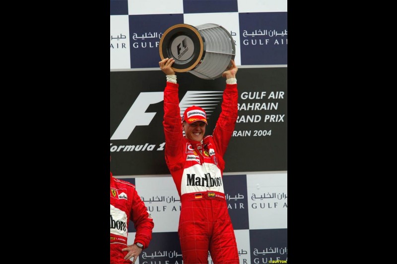 Michael Schumacher, Ferrari, celebrates victory. The Bahrain Grand Prix. Bahrain International Circuit, April 4th 2004.