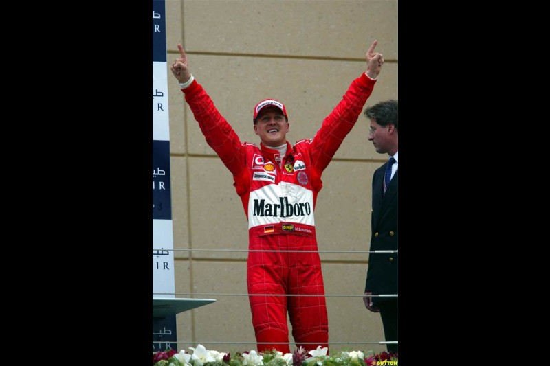 Michael Schumacher, Ferrari, celebrates victory. The Bahrain Grand Prix. Bahrain International Circuit, April 4th 2004.