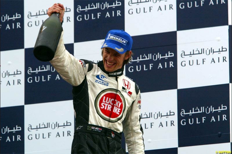 Jenson Button, BAR, celebrates third place. The Bahrain Grand Prix. Bahrain International Circuit, April 4th 2004.