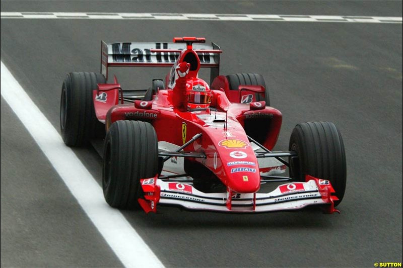 Michael Schumacher, Ferrari, celebrates victory. The Bahrain Grand Prix. Bahrain International Circuit, April 4th 2004.