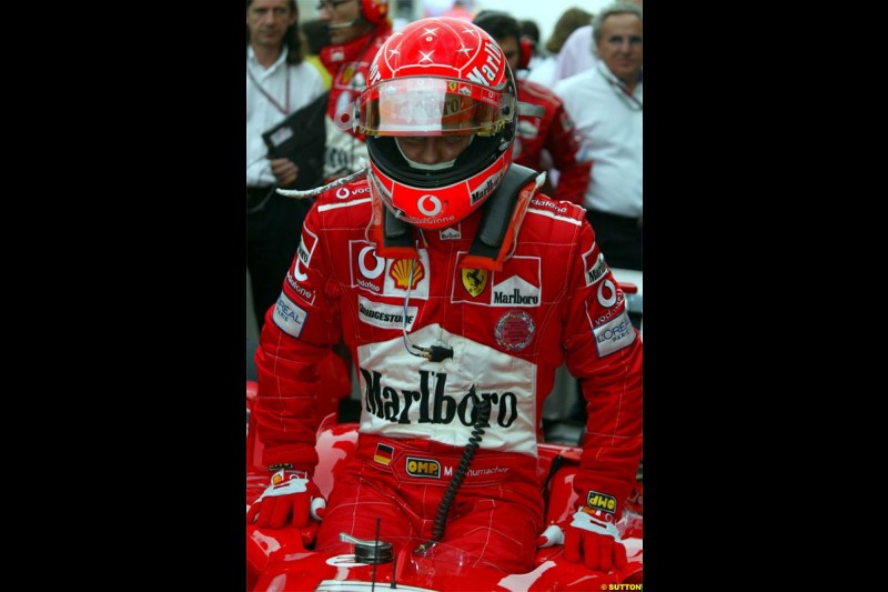Michael Schumacher, Ferrari, prepares for the race. The Bahrain Grand Prix. Bahrain International Circuit, April 4th 2004.