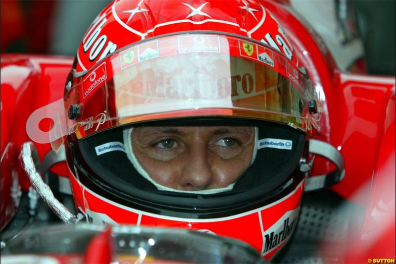 Michael Schumacher, Ferrari, prepares for the race. The Bahrain Grand Prix. Bahrain International Circuit, April 4th 2004.
