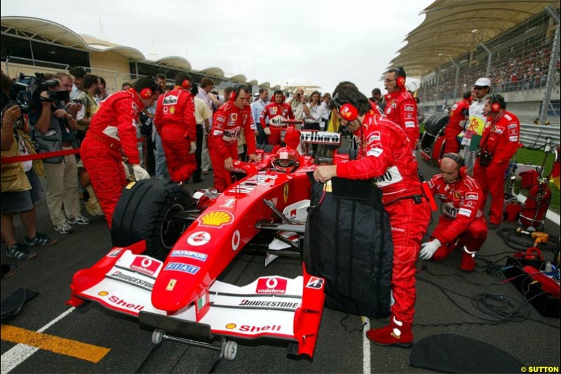 Michael Schumacher, Ferrari, prepares for the race. The Bahrain Grand Prix. Bahrain International Circuit, April 4th 2004.