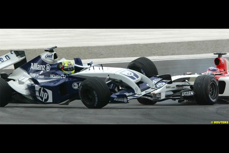 Ralf Schumacher comes in contact with Takuma Sato. The Bahrain Grand Prix. Bahrain International Circuit, April 4th 2004.