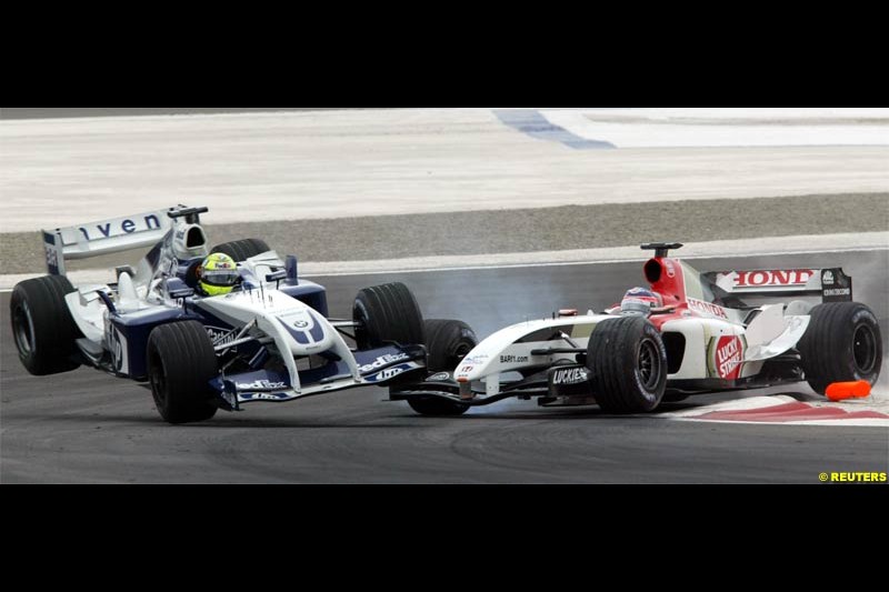 Ralf Schumacher comes in contact with Takuma Sato. The Bahrain Grand Prix. Bahrain International Circuit, April 4th 2004.