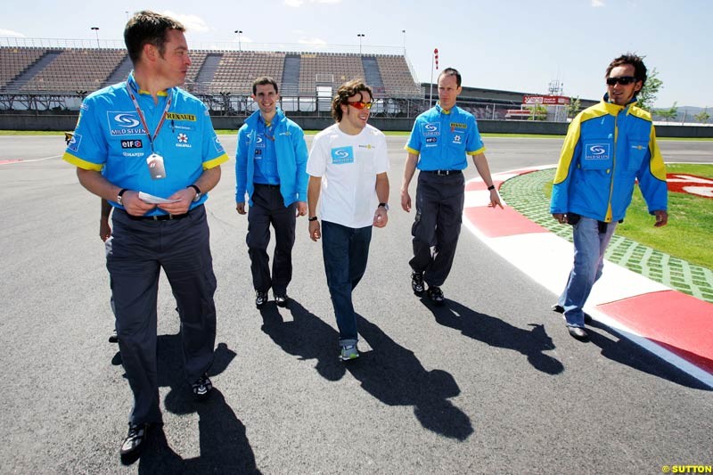 Fernando Alonso, Franck Montagny, and Renault engineers walk the circuit;  May 6th, 2004.