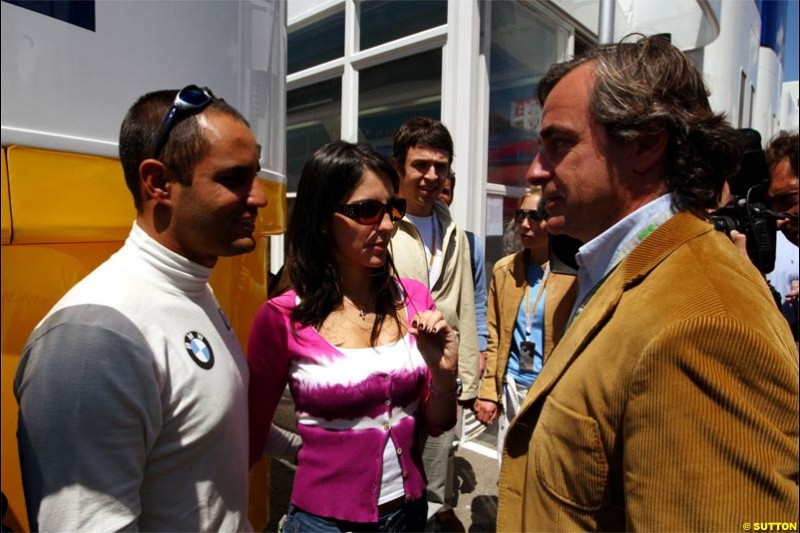 Carlo Sainz, Citroen Rally Driver, talks with Juan Pablo Montoya, Williams. Spanish Grand Prix Saturday. Circuit de Catalunya. Barcelona, Spain. May 8th 2004.