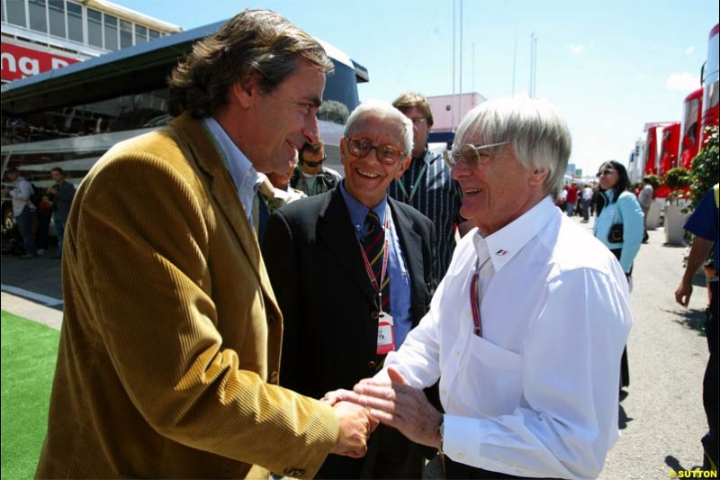 Bernie Ecclestone, F1 Supremo, meets Carlos Sainz, Citroen Rally Driver. Spanish Grand Prix Saturday. Circuit de Catalunya. Barcelona, Spain. May 8th 2004.