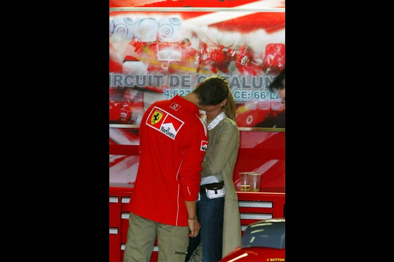 Michael Schumacher, Ferrari, enjoys a quiet moment with wife Corinna. Spanish Grand Prix Saturday. Circuit de Catalunya. Barcelona, Spain. May 8th 2004.