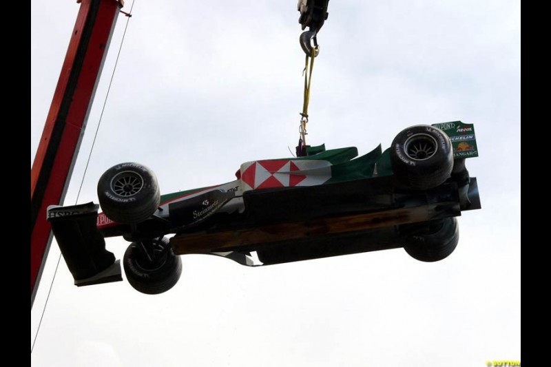 Mark Webber's Jaguar is lifted after breaking down in practice for the Monaco GP, Thursday May 20th, 2004. 