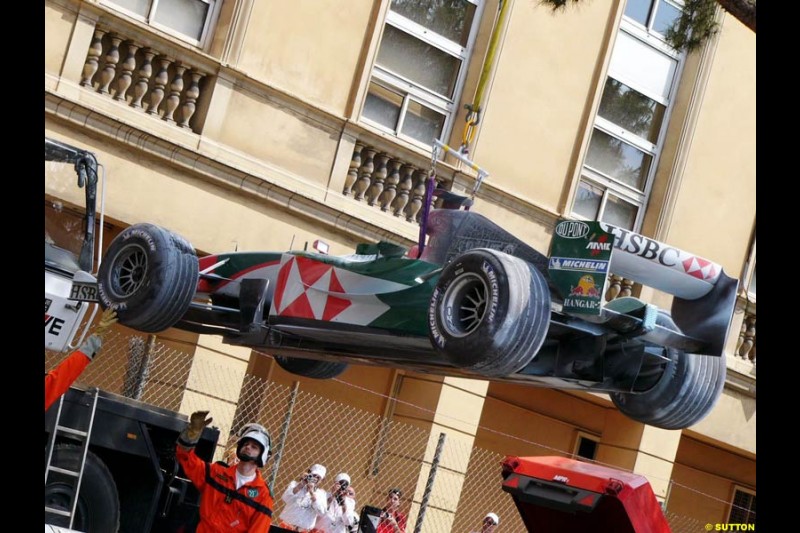 Mark Webber's Jaguar is lifted after breaking down in practice for the Monaco GP, Thursday May 20th, 2004.