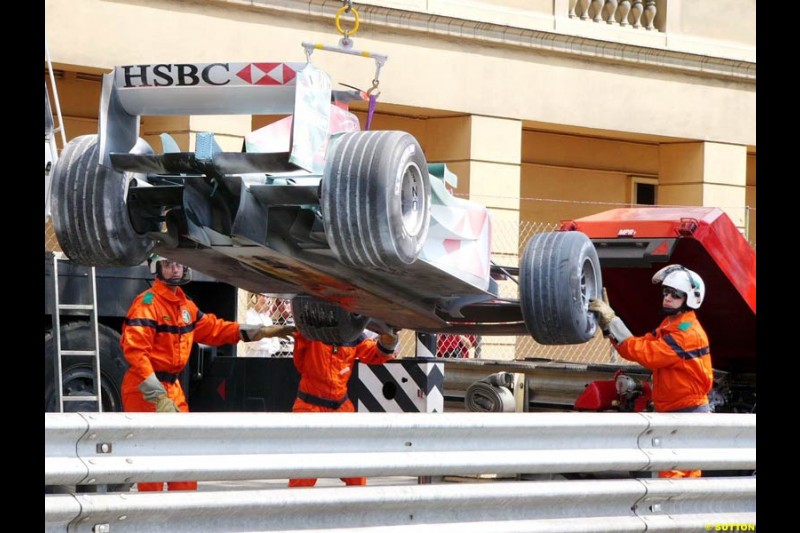 Mark Webber's Jaguar is lifted after breaking down in practice for the Monaco GP, Thursday May 20th, 2004.