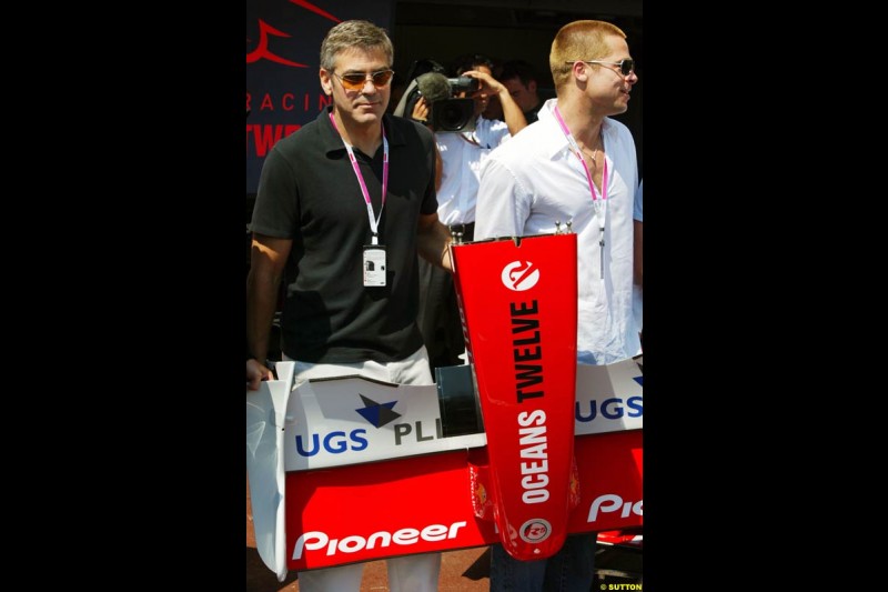 Actors George Clooney and Brad Pitt at the Monaco Grand Prix, Saturday 22nd May, 2004.