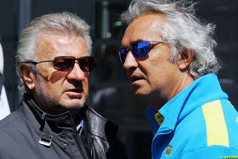 Willi Weber  and   Flavio Briatore,  European GP, Saturday May 29th, 2004.