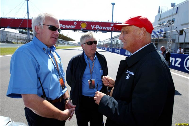 Charlie Whiting, Herbie Bash, and Niki Lauda;  European GP, Saturday May 29th, 2004.