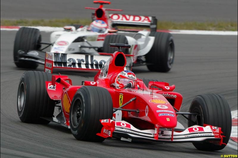 Rubens Barrichello, Ferrari; Jenson Button, BAR-Honda; European GP, Sunday May 30th, 2004.