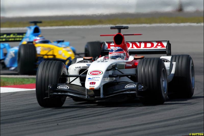 Takuma Sato, BAR-Honda; Fernando Alonso, Renault;  European GP, Sunday May 30th, 2004.