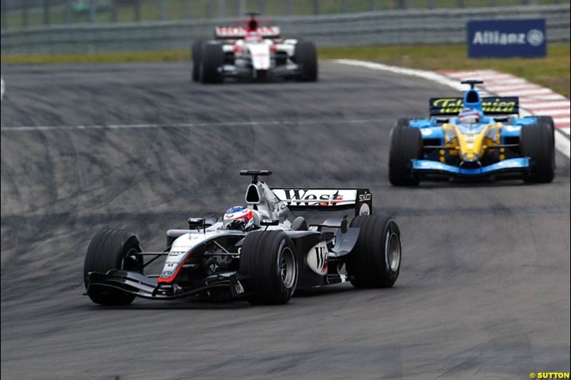 Kimi Raikkonen, Mclaren-Mercedes; Fernando Alonso, Renault; Takuma Sato, BAR-Honda; European GP, Sunday May 30th, 2004.