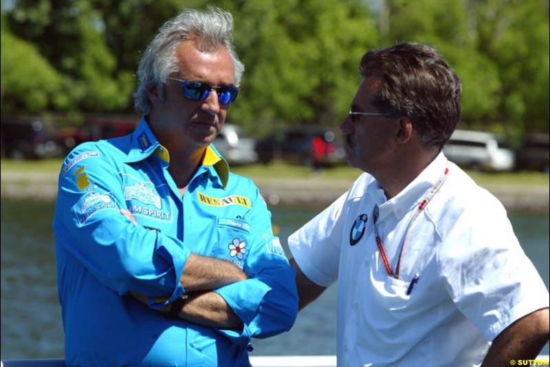 Flavio Briatore with BMW motorsport director Mario Theissen. The Canadian Grand Prix, Montreal, Canada. Saturday, June 13th, 2004.