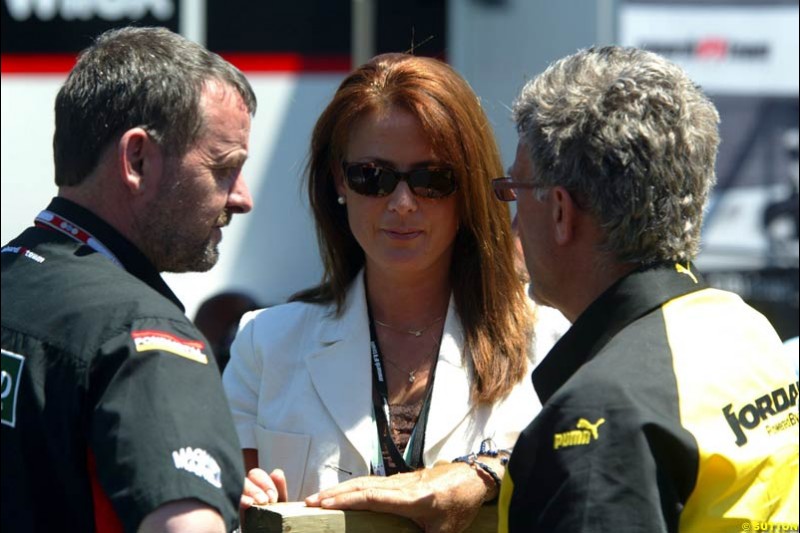 Minardi's Paul Stoddart and Eddie Jordan with a European Aviation air stewardess. The Canadian Grand Prix, Montreal, Canada. Saturday, June 13th, 2004.