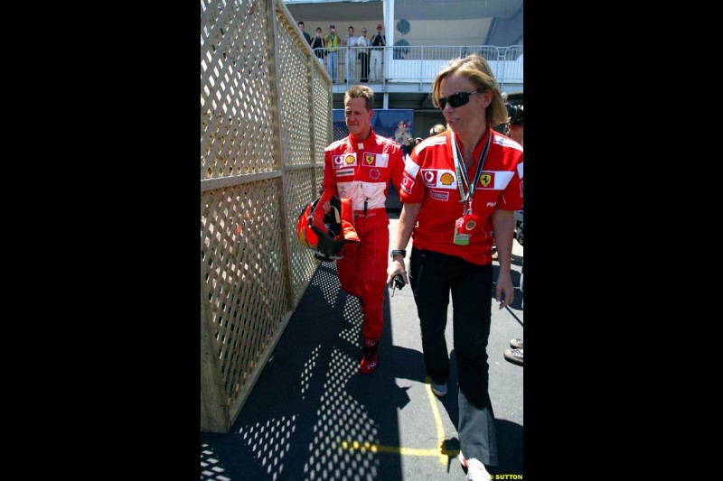 Michael Schumacher and his press officer, Sabine Kehm. The Canadian Grand Prix, Montreal, Canada. Saturday, June 13th, 2004.